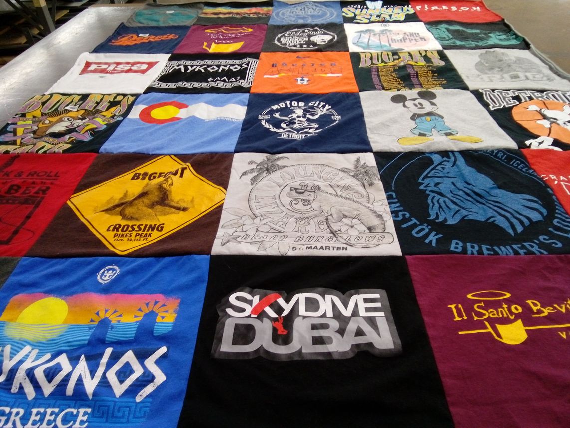 T-shirt quilt with travel, food themes by Holden from MI