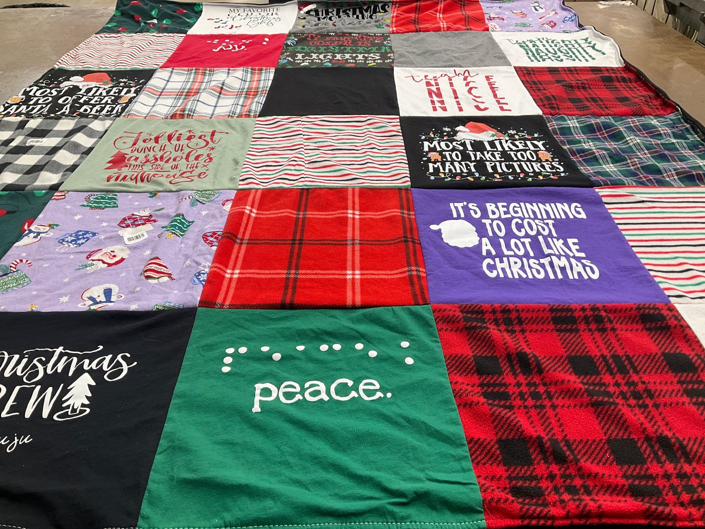 T-shirt quilt with holiday spirit, festive designs themes by julie from OH