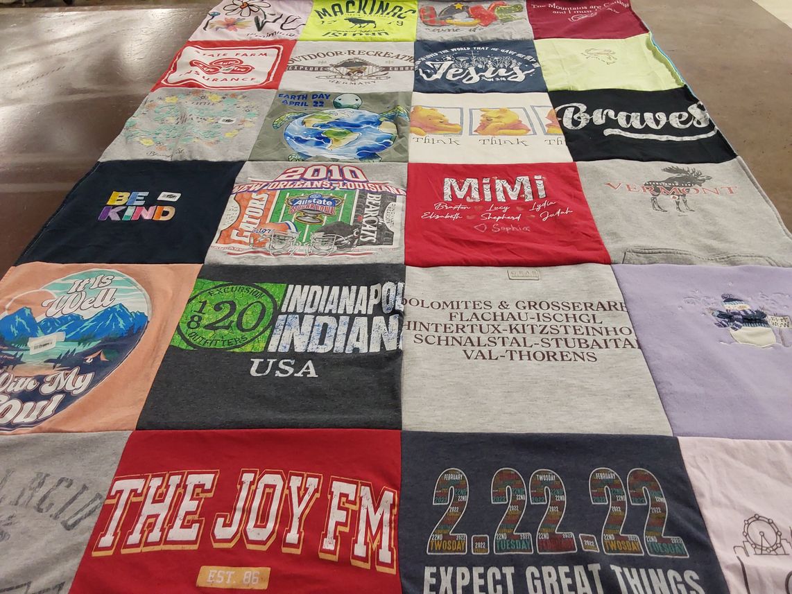 T-shirt quilt with charity, community themes by Debra from FL