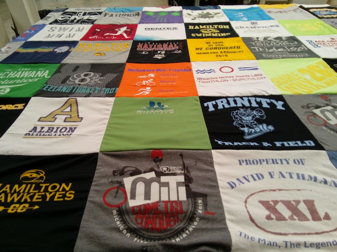 T-shirt quilt featuring hamilton hawkeyes cross country, trinity track and field by Amy from CA