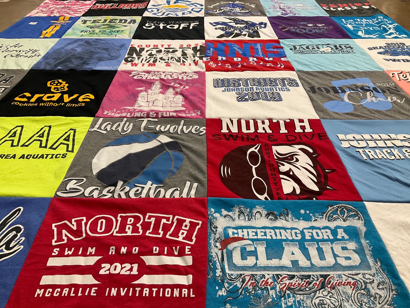 T-shirt quilt featuring north swim and dive, johnson track and field by Donna from GA