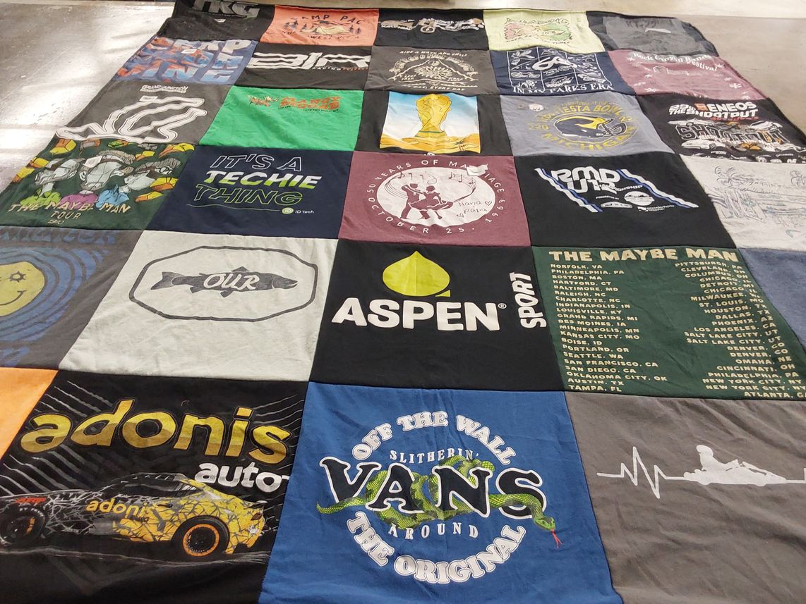 T-shirt quilt with technology, sports themes by Mary Ann from CO