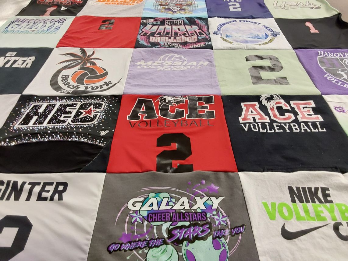 T-shirt quilt with cheerleading, volleyball themes by Rae Ann from PA