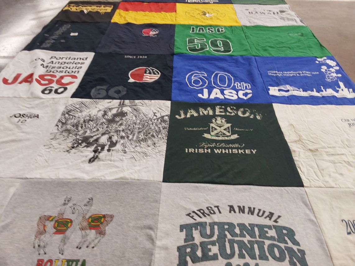 T-shirt quilt with travel, whiskey themes by Joshua from MD