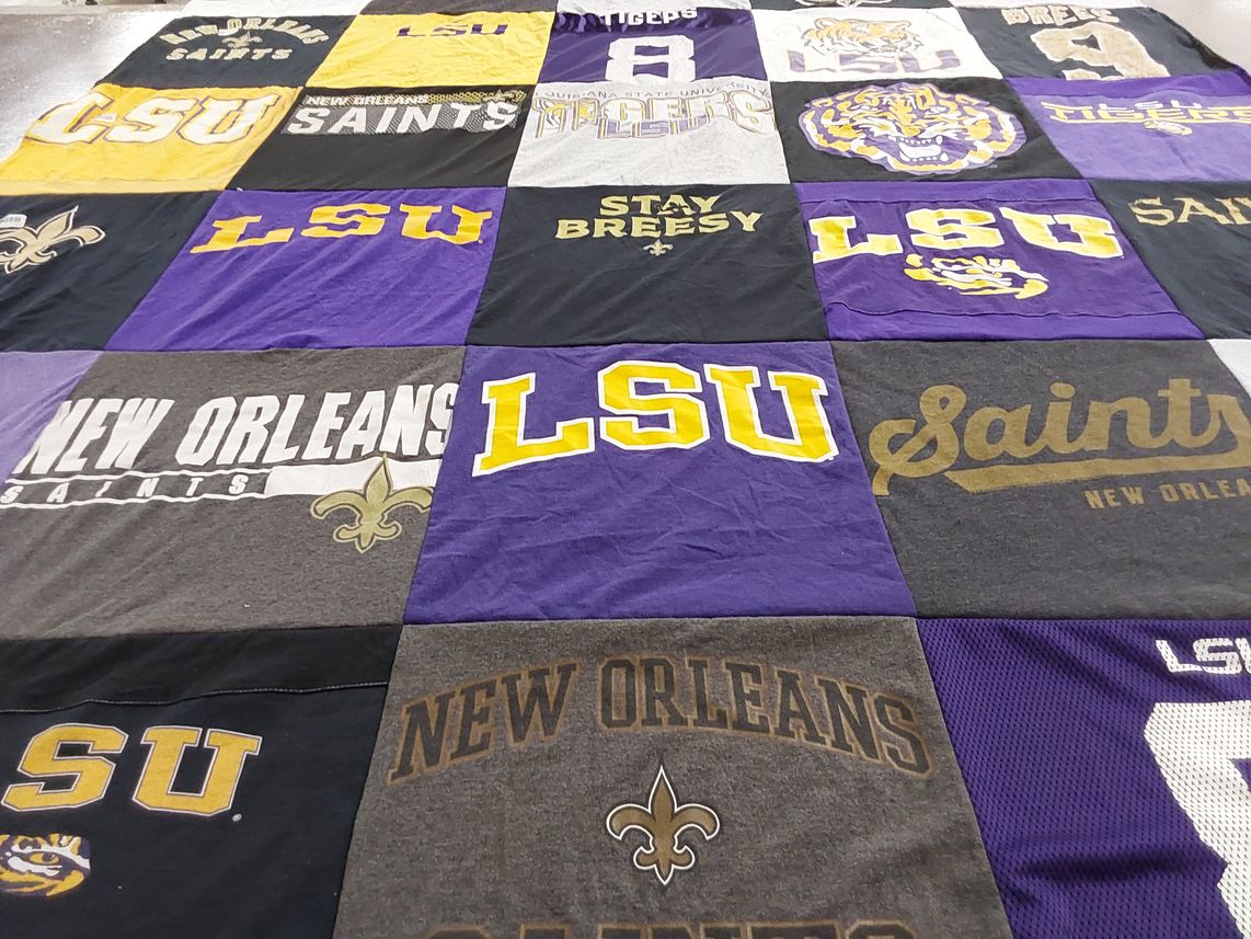 T-shirt quilt featuring new orleans saints, louisiana state university tigers by CJ from TX