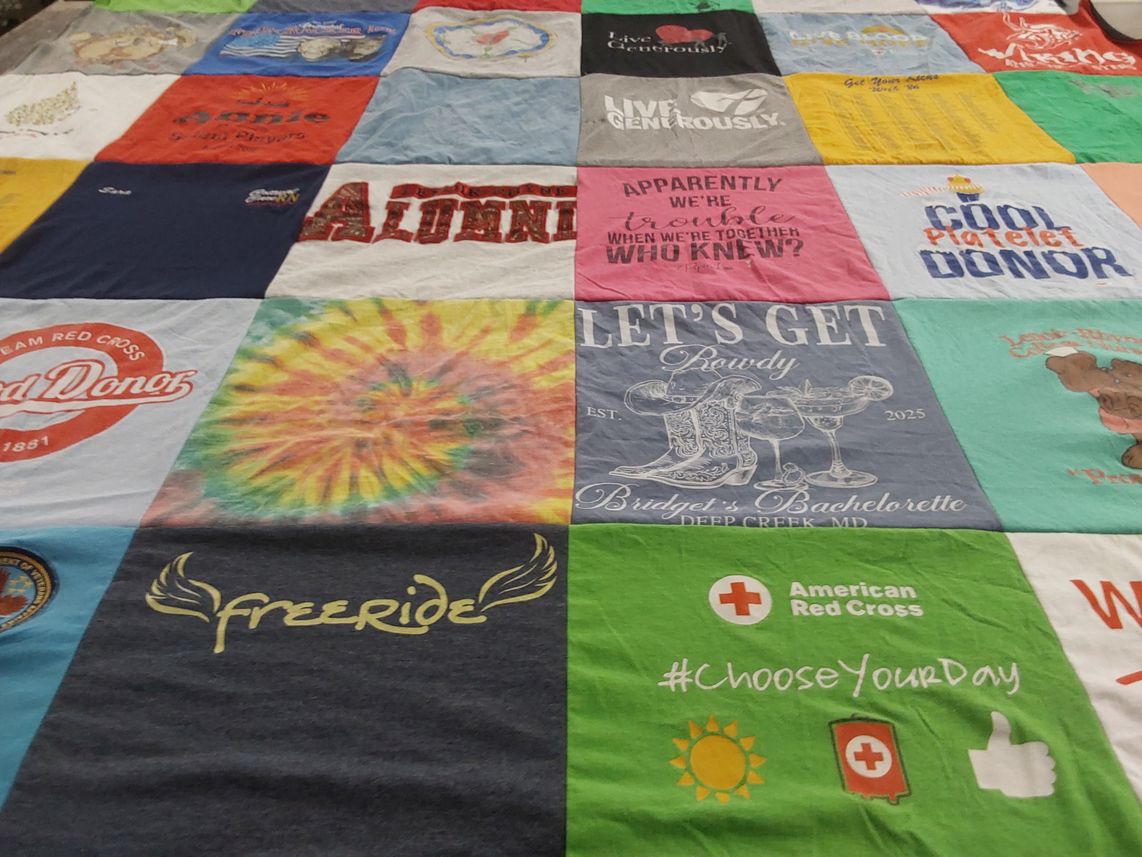 T-shirt quilt with donating, generosity themes by Sara from MD