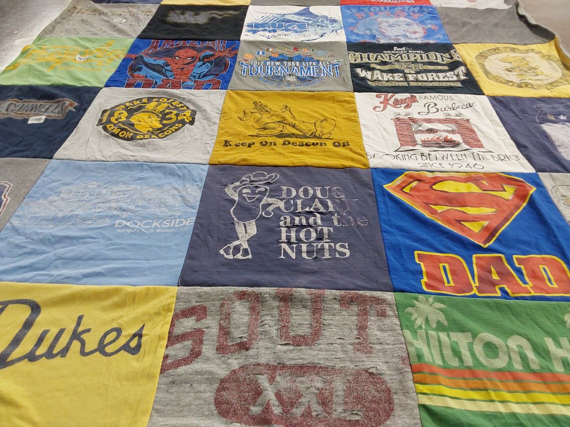 T-shirt quilt with cooking, sports themes by Kate from VA