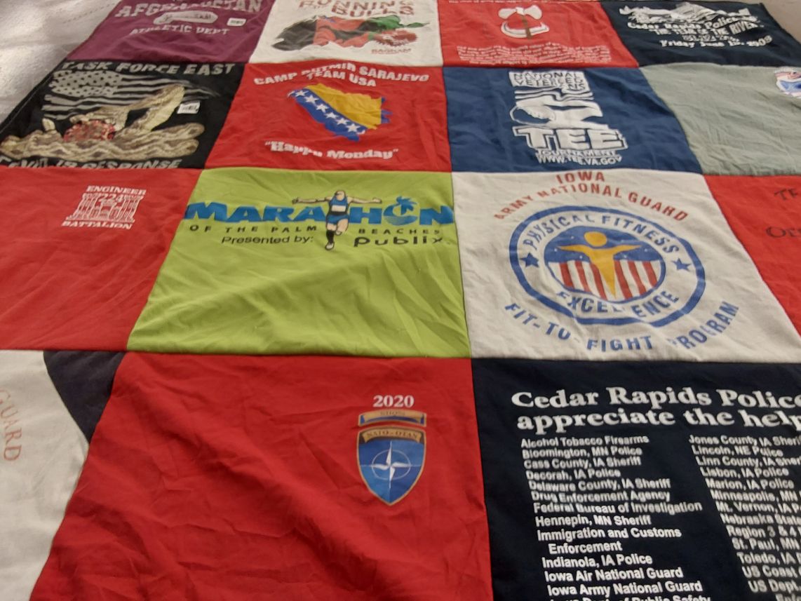 T-shirt quilt with military, fitness themes by Tamra from IA