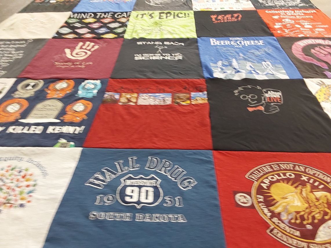 T-shirt quilt with beer, cheese themes by Allegra from WI