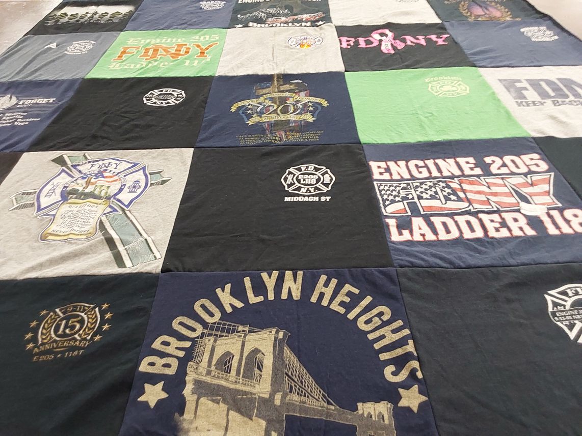 T-shirt quilt with firefighting, emergency services themes by Katie from NY