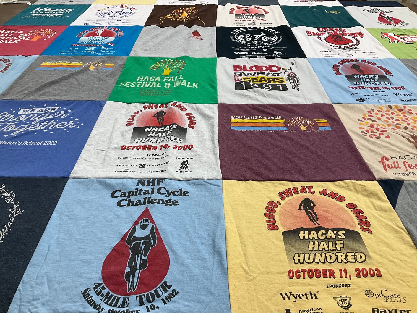 T-shirt quilt with cycling, community events themes by Robin from VA