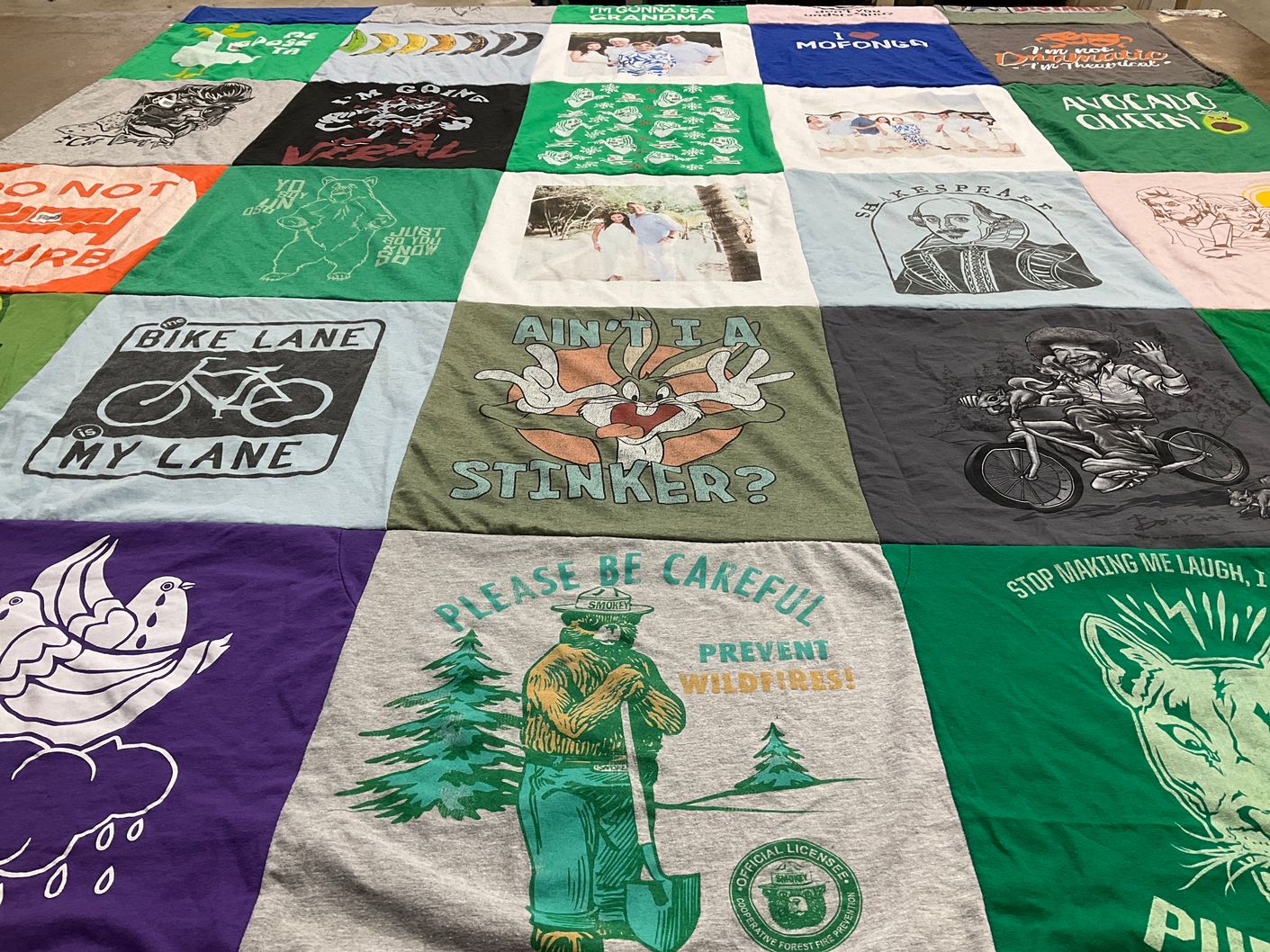 T-shirt quilt with biking, environmental awareness themes by Alexandra from FL