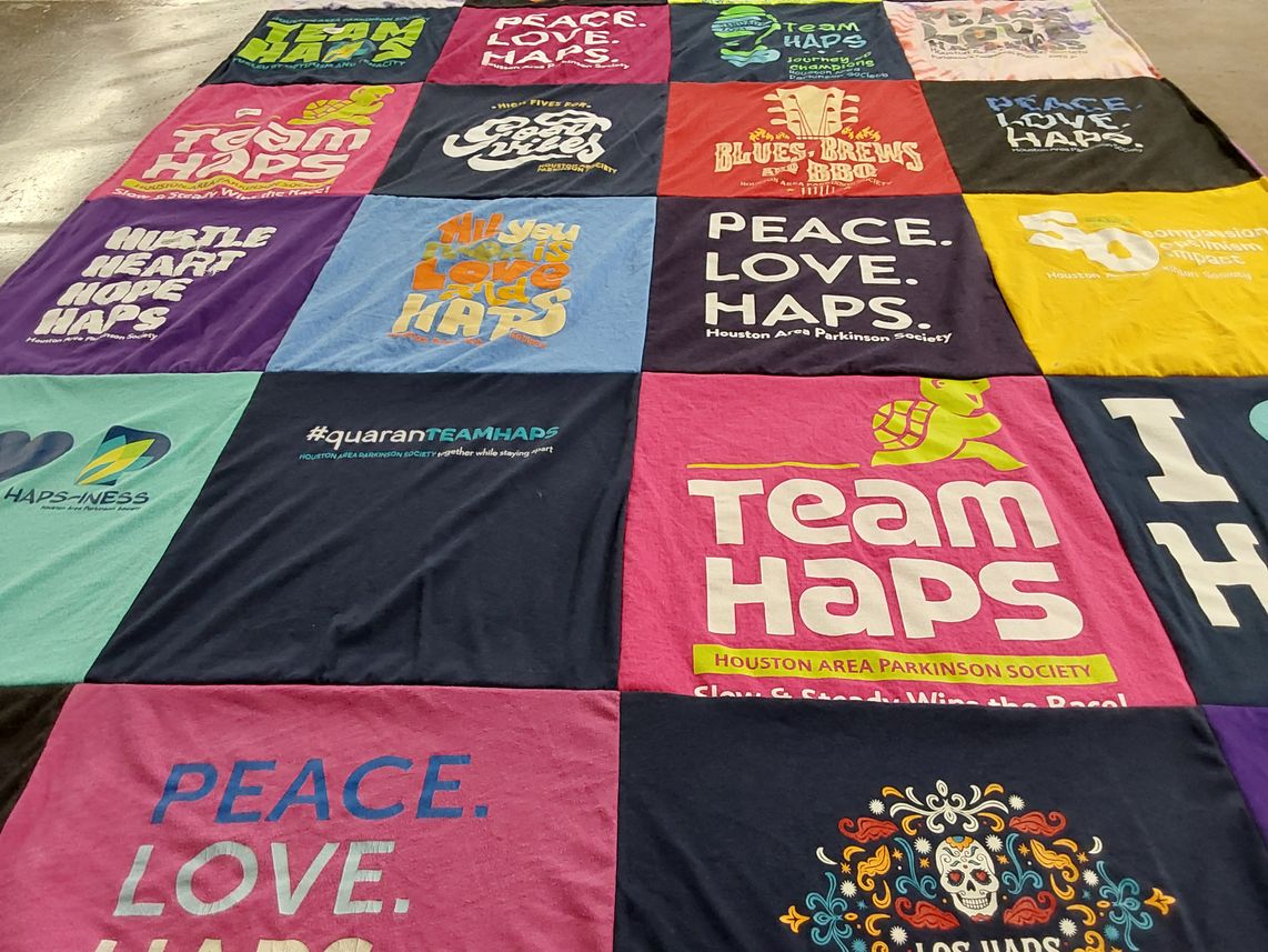 T-shirt quilt with community, support themes by Lori from TX