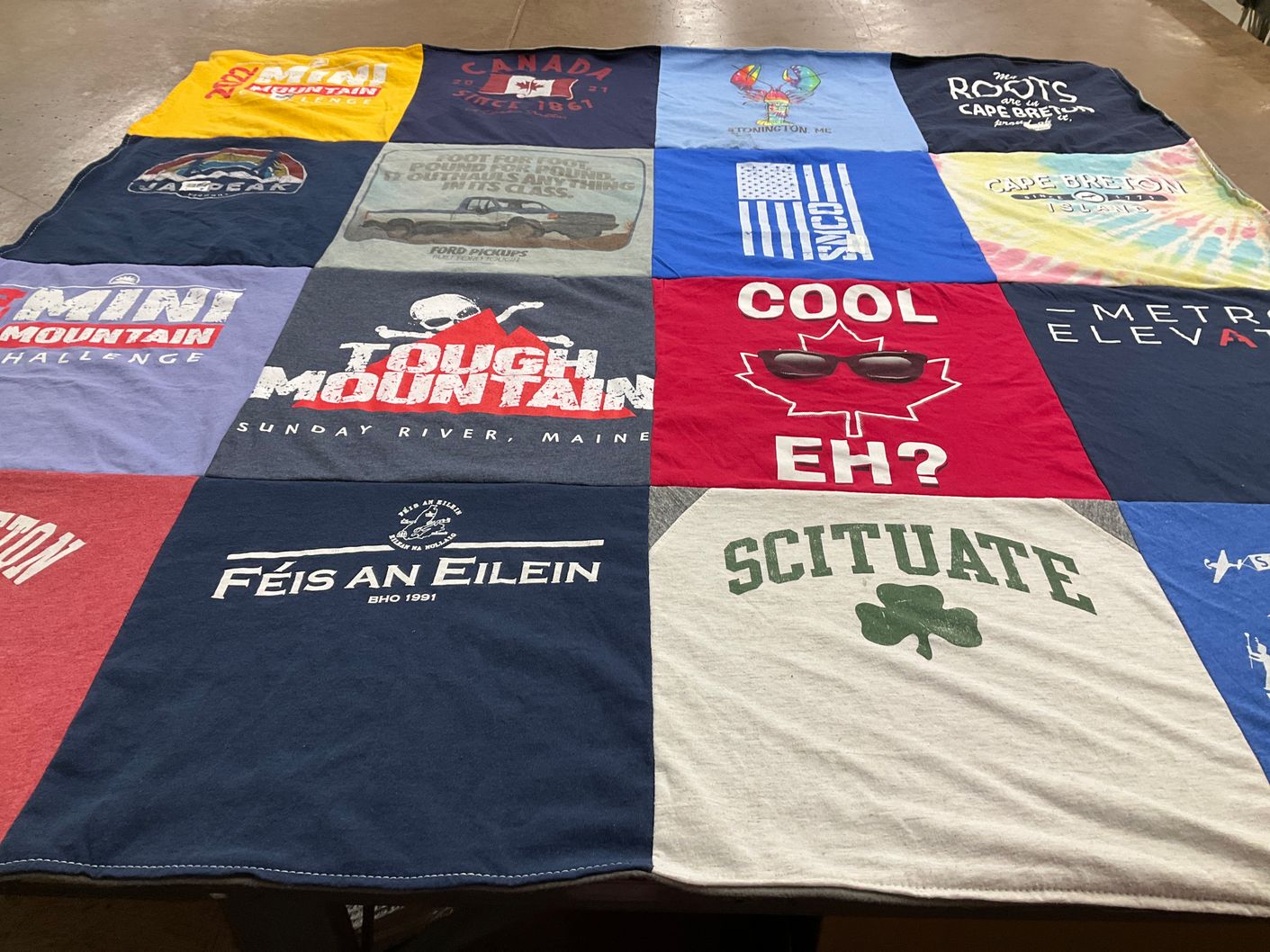 T-shirt quilt with mountain biking, skiing themes by Peter from MA