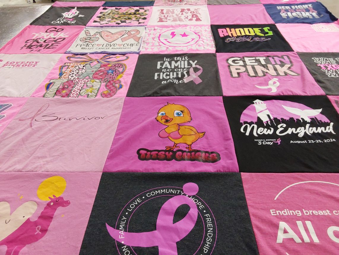 T-shirt quilt with breast cancer awareness themes by Kim from TX
