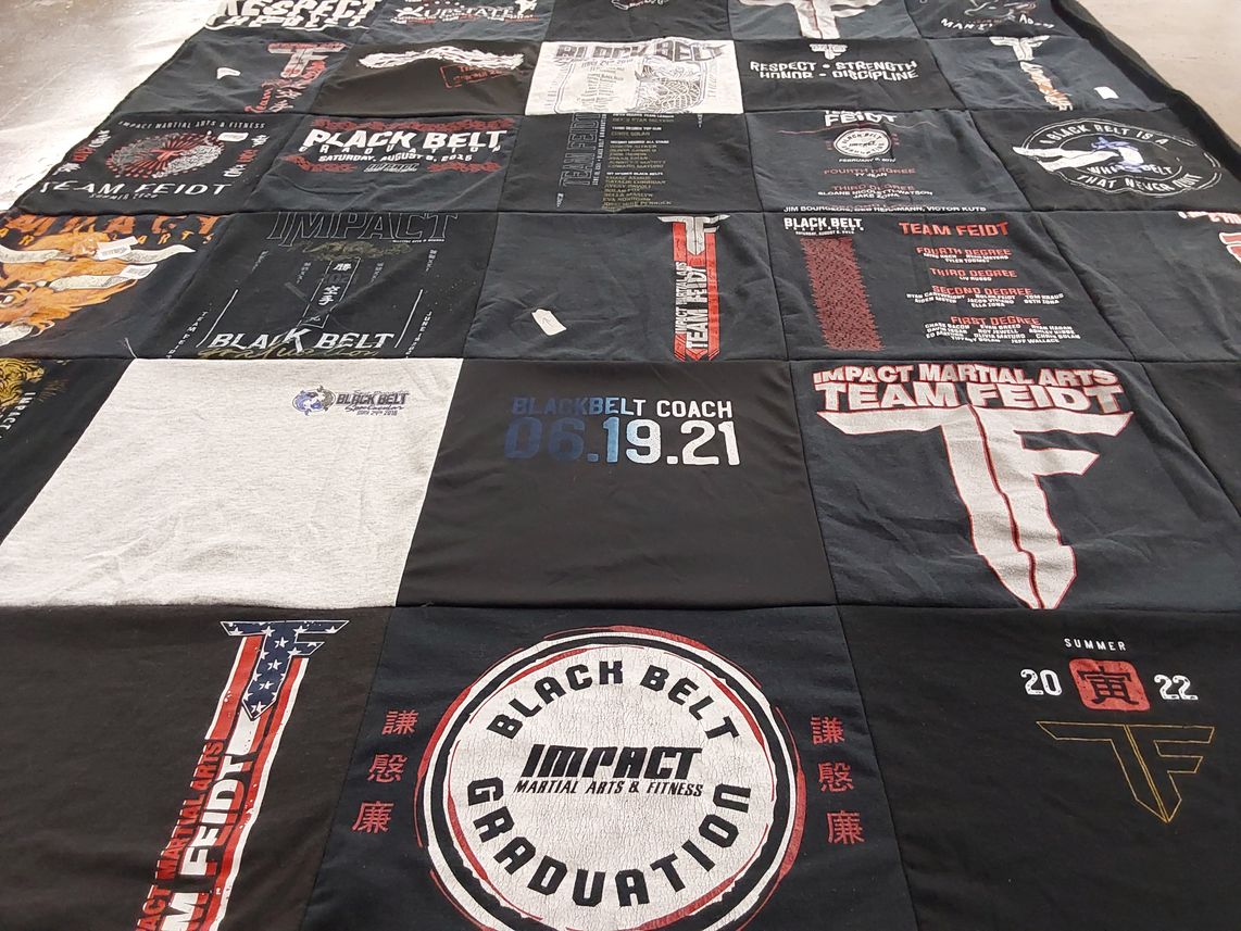 T-shirt quilt with martial arts, fitness themes by Emma from NY