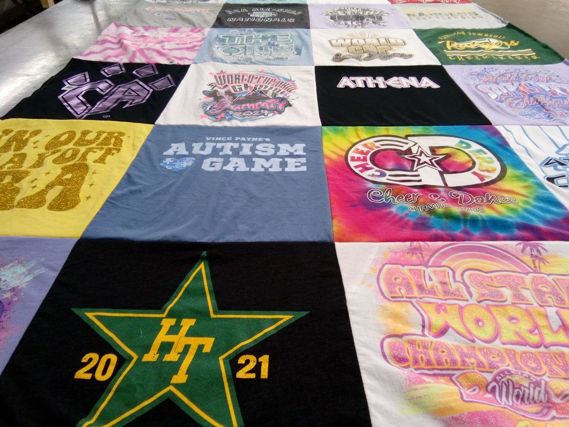T-shirt quilt with cheerleading, dance themes by Julie from OH