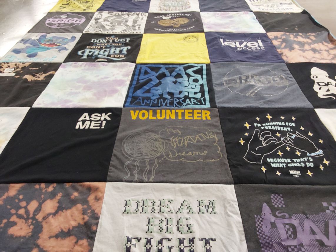 T-shirt quilt with volunteering, activism themes by Ellen from MI