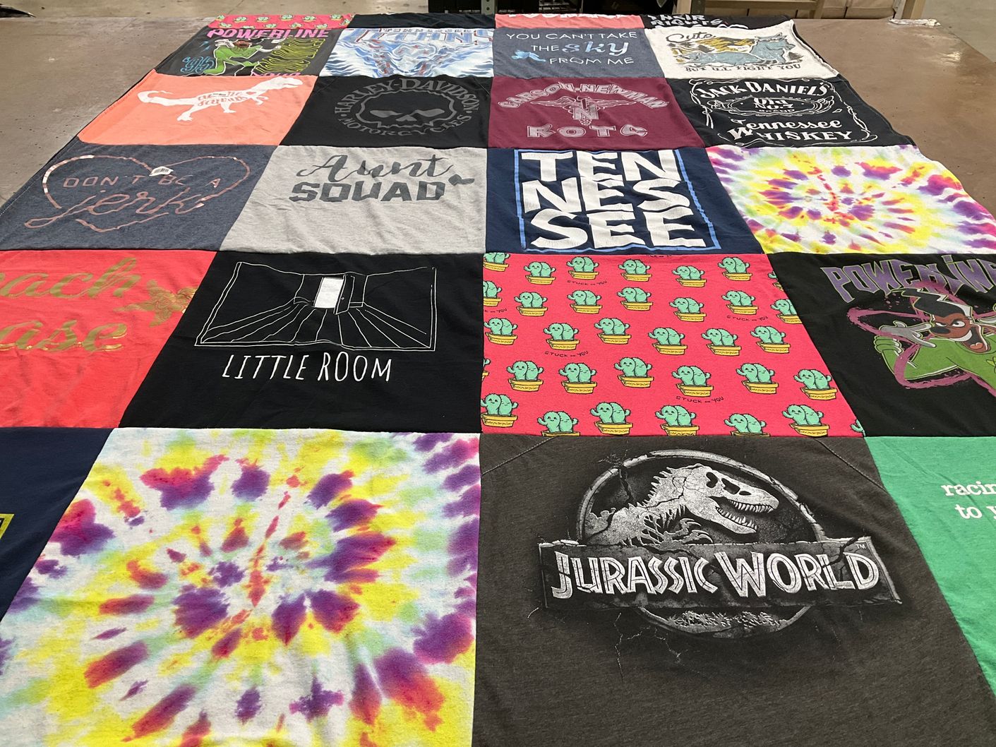 T-shirt quilt with whiskey, jurassic park themes by Rachel from TN