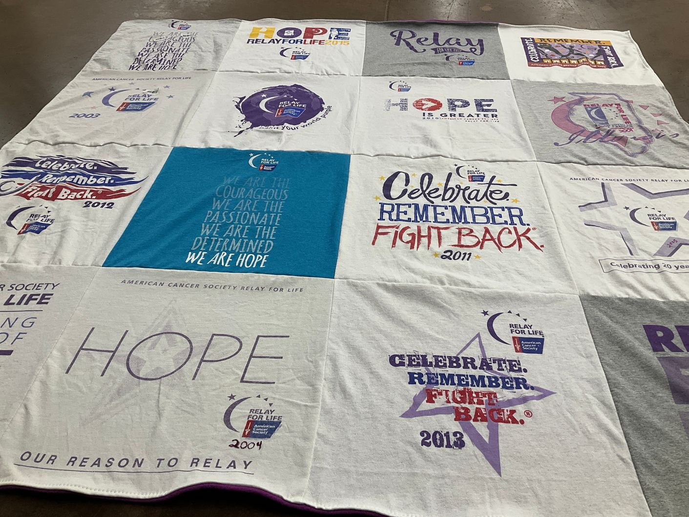 T-shirt quilt with cancer awareness, community support themes by Christy from IL