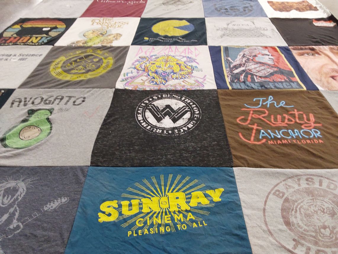 T-shirt quilt with cinema, music themes by Heather from FL