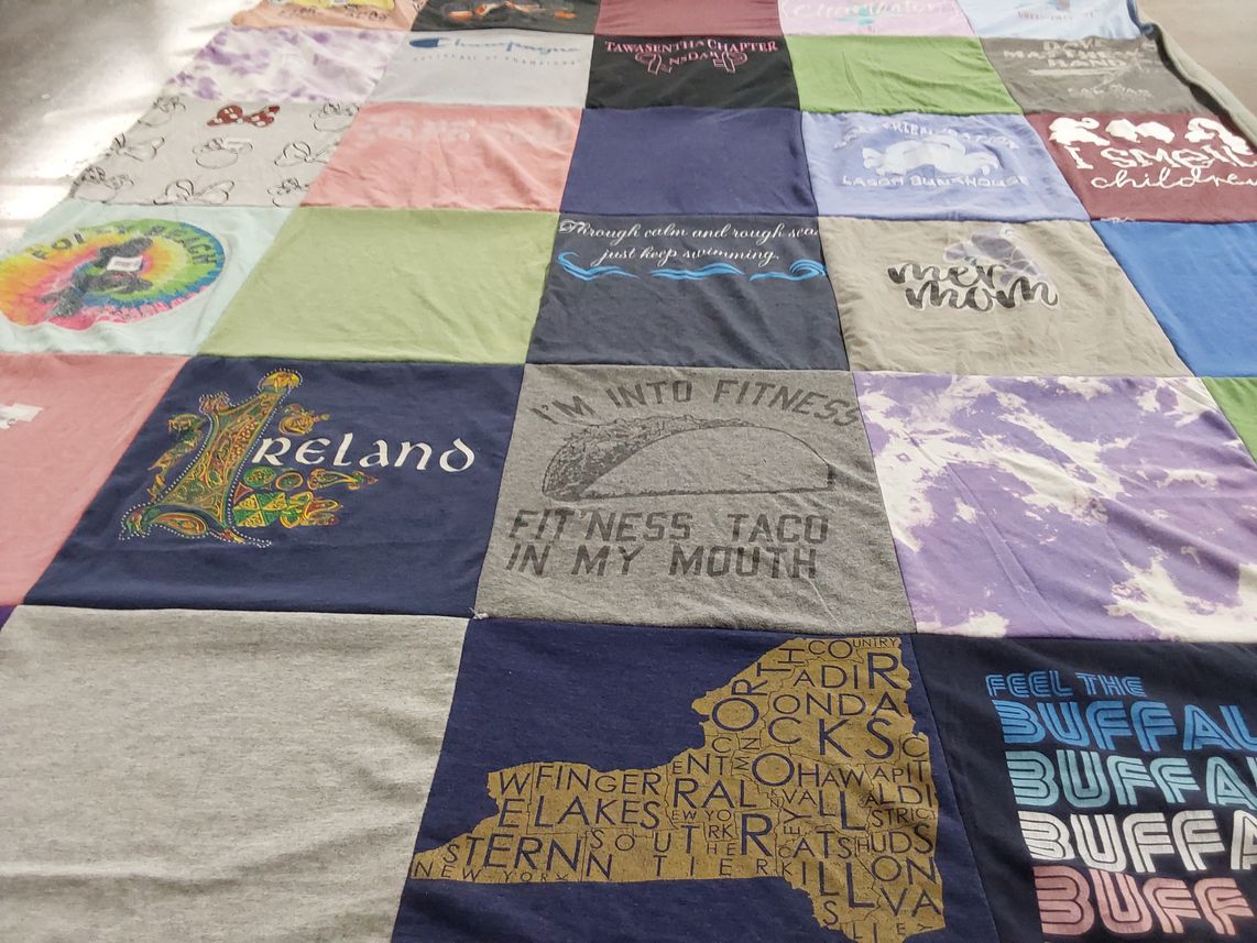 T-shirt quilt with fitness, travel themes by Joann from NY