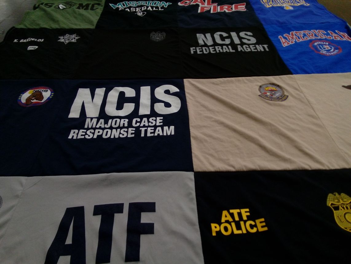 T-shirt quilt with law enforcement, sports themes by Kenneth from CA
