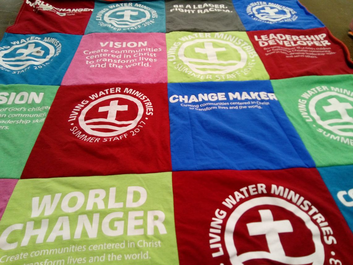 T-shirt quilt with community development, leadership training themes by Martha from MI