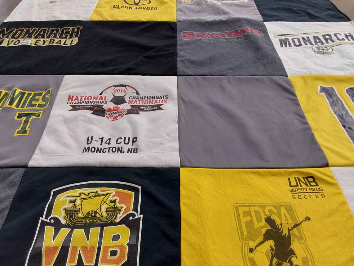 T-shirt quilt featuring unb varsity reds, monarch volleyball by Laura from CO