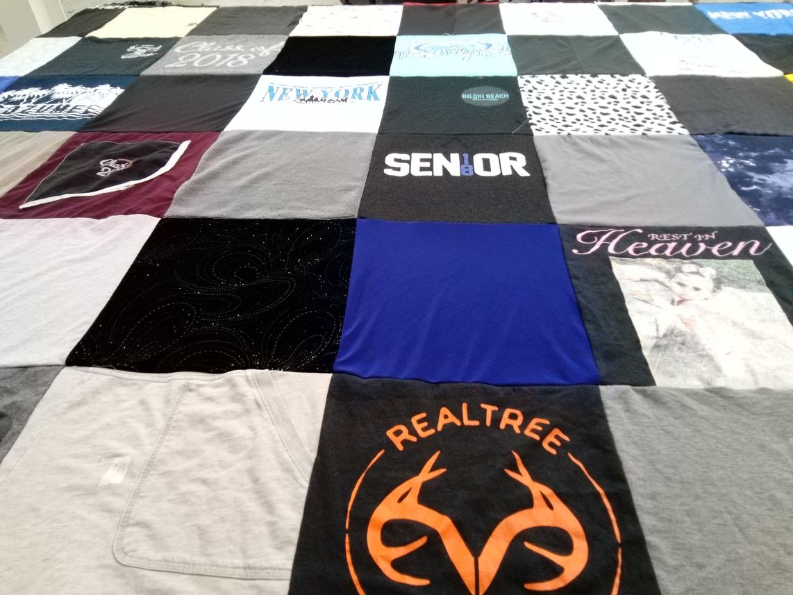 T-shirt quilt with graduation, hunting themes by Brandy from LA