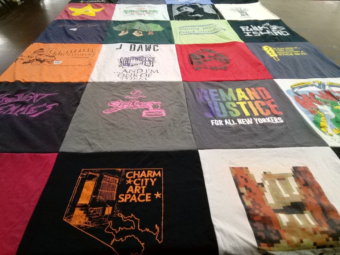 T-shirt quilt with art, activism themes by Elizabeth from NY