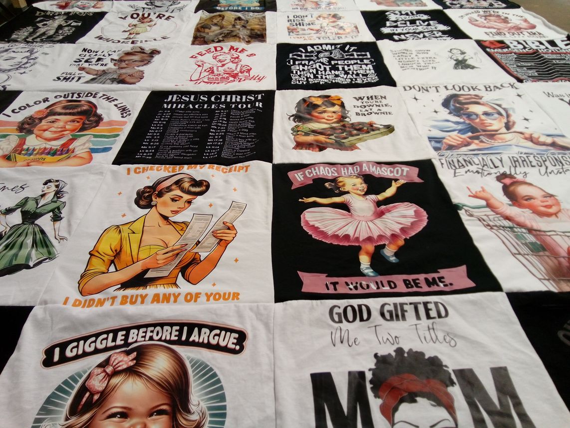 T-shirt quilt with art, humor themes by Cristinella from TX