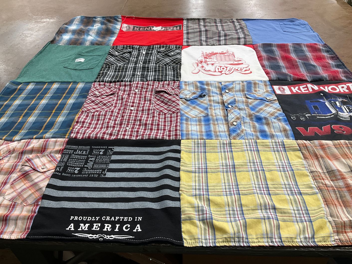 T-shirt quilt with trucking, motor vehicles themes by Joan from IA