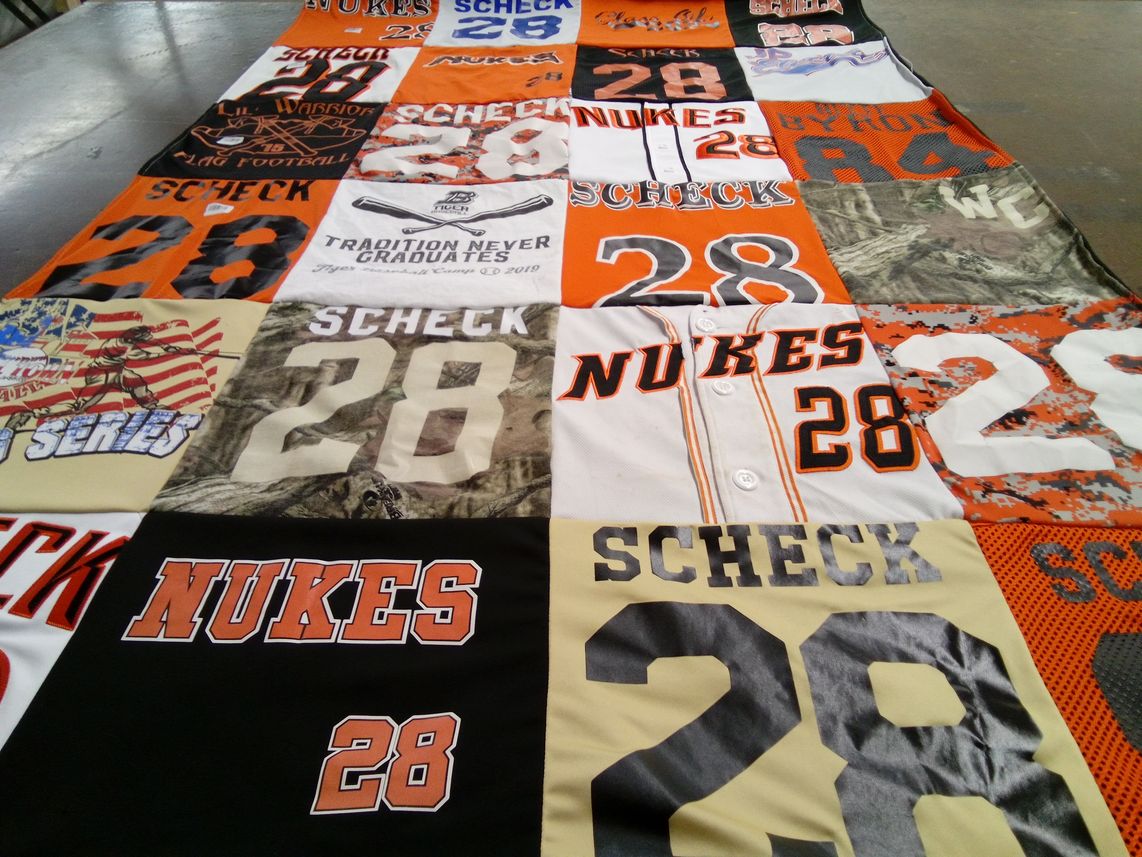 T-shirt quilt with sports, football themes by Lori from IL
