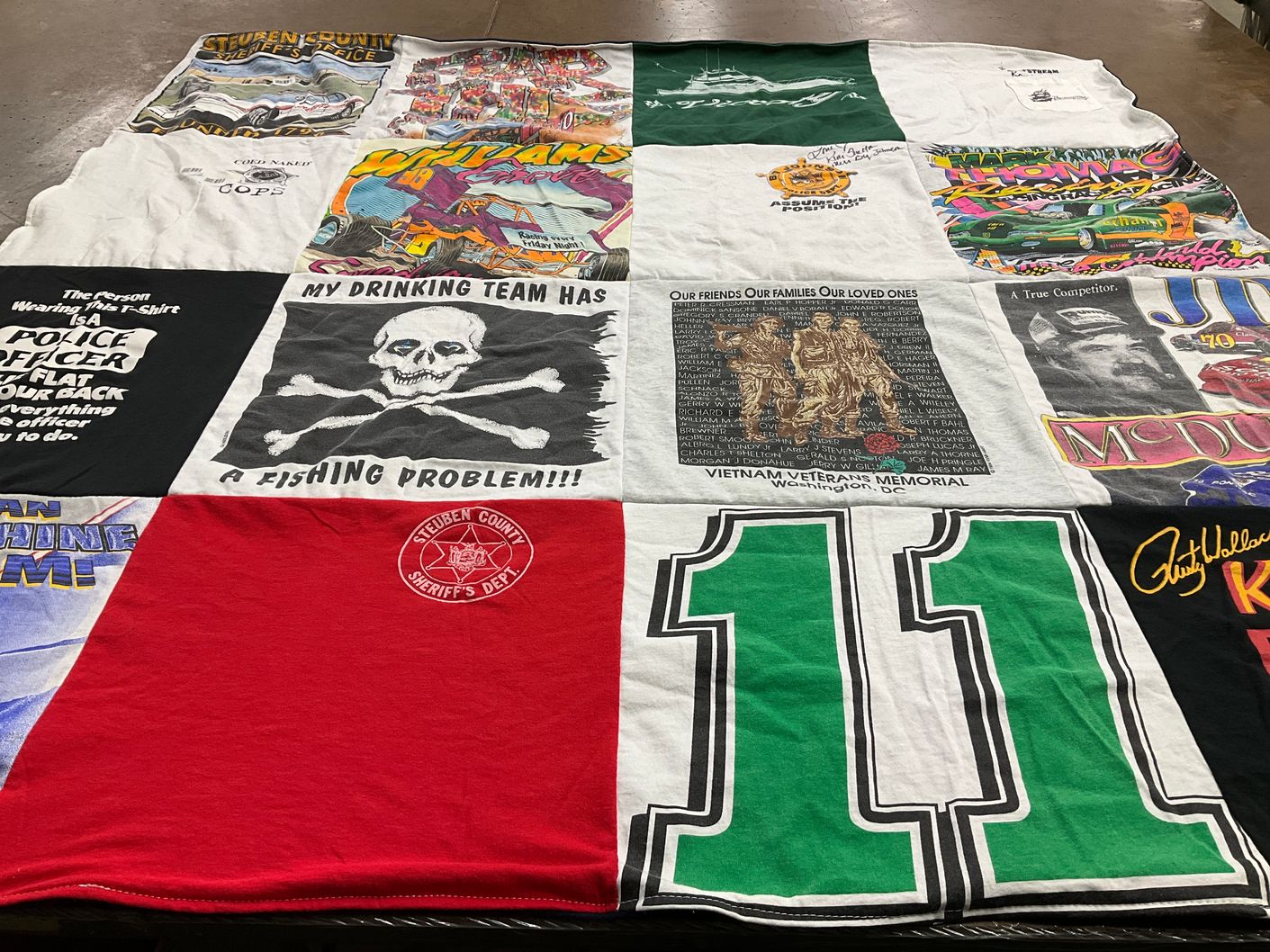 T-shirt quilt with fishing, military themes by Terri from NY