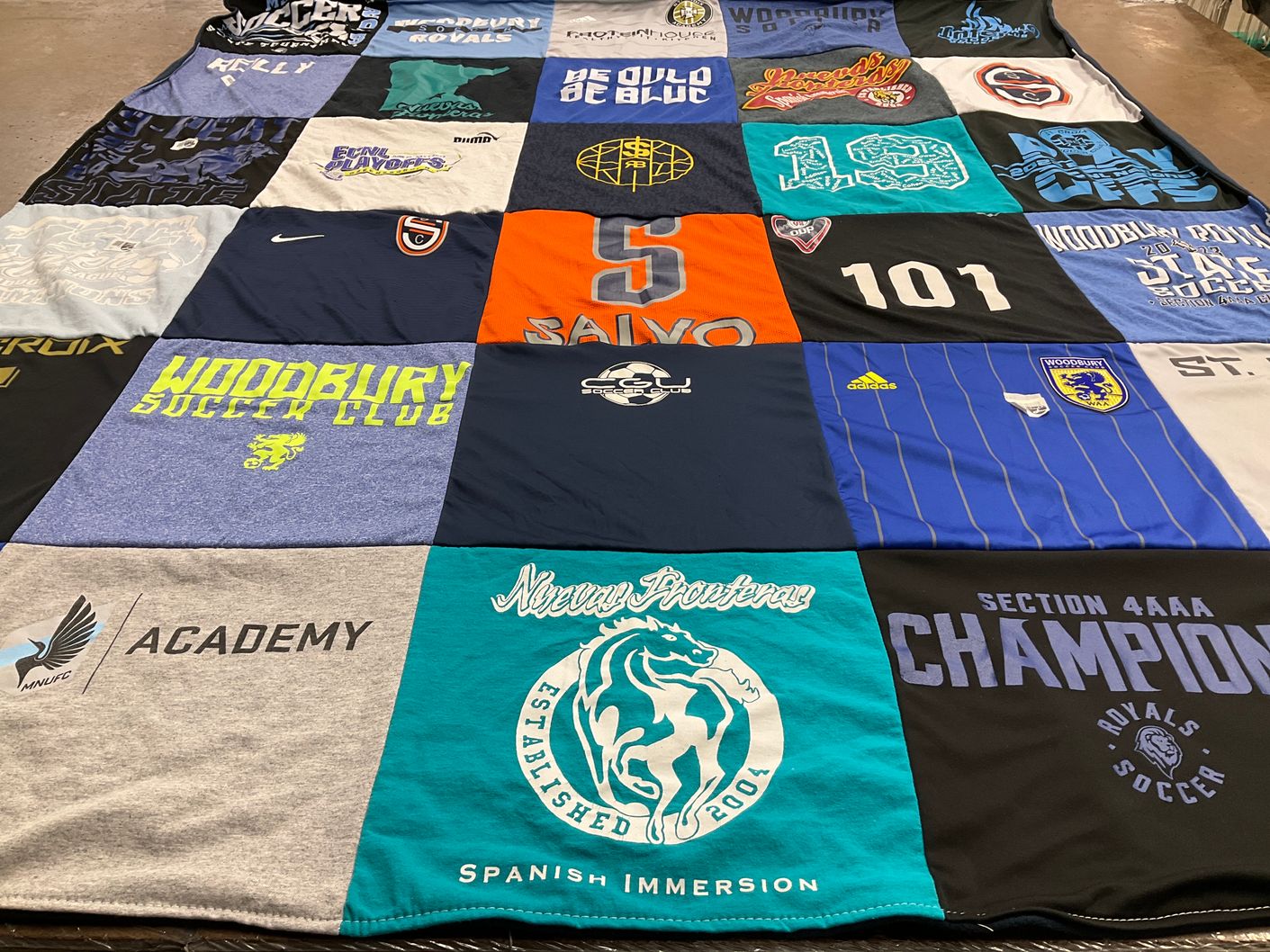 T-shirt quilt featuring woodbury high school soccer team by Bridget from MN