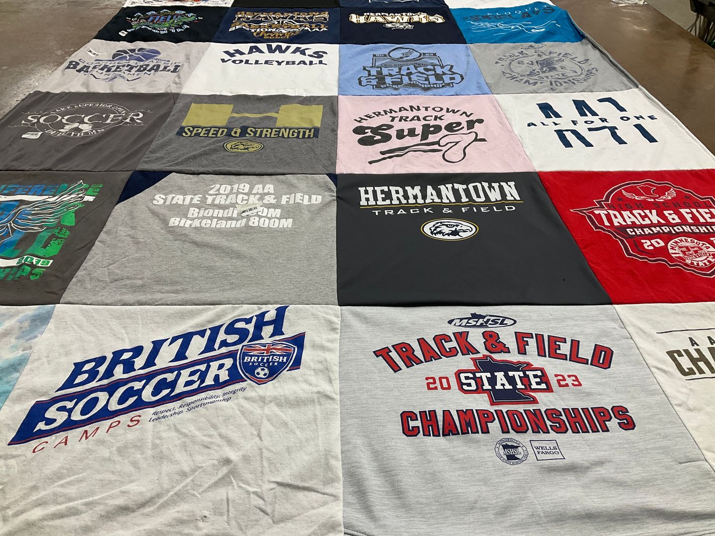 T-shirt quilt featuring hermantown track and field by Kelly from MN