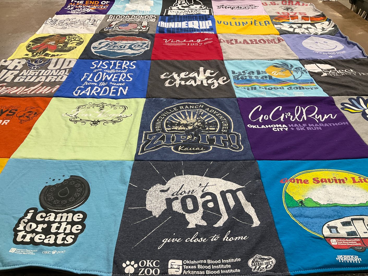 T-shirt quilt with volunteering, running themes by Cindy from OK