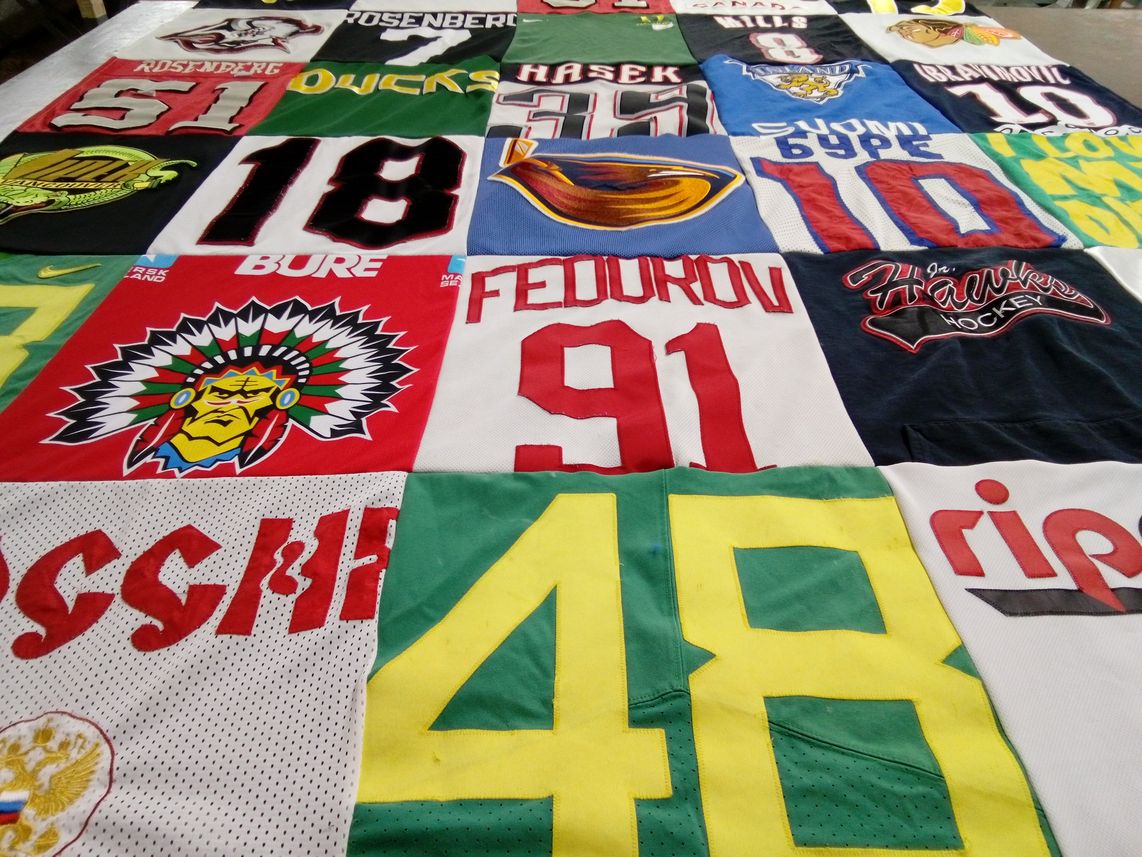 T-shirt quilt with hockey, sports themes by Sam from OR