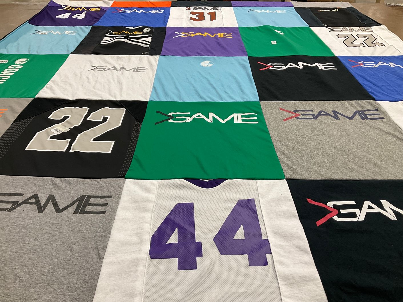 T-shirt quilt with sports themes by Jennifer from OH