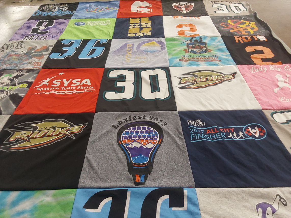 T-shirt quilt with lacrosse, youth sports themes by Cindy from CA
