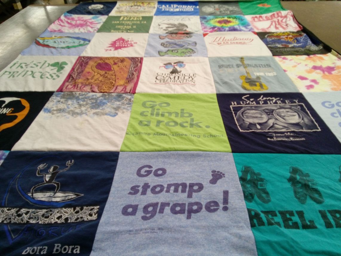 T-shirt quilt with climbing, surfing themes by Mary from CA