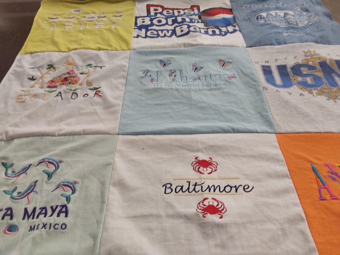 T-shirt quilt with travel, geography themes by Jacque from KS
