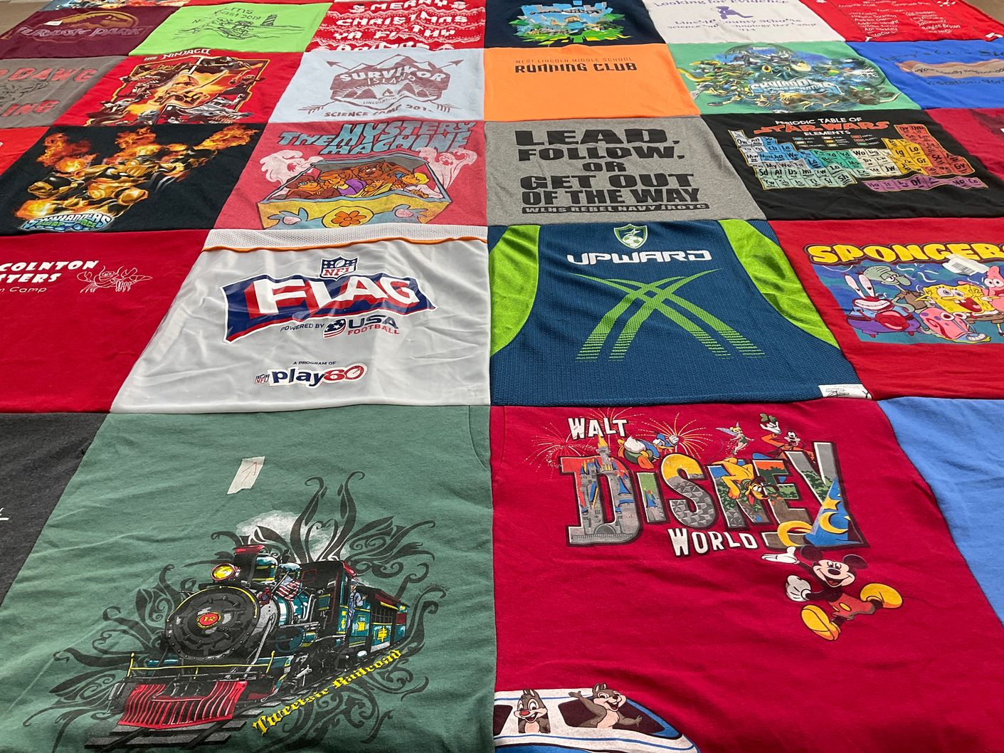 T-shirt quilt with science, games themes by Kellie from NC