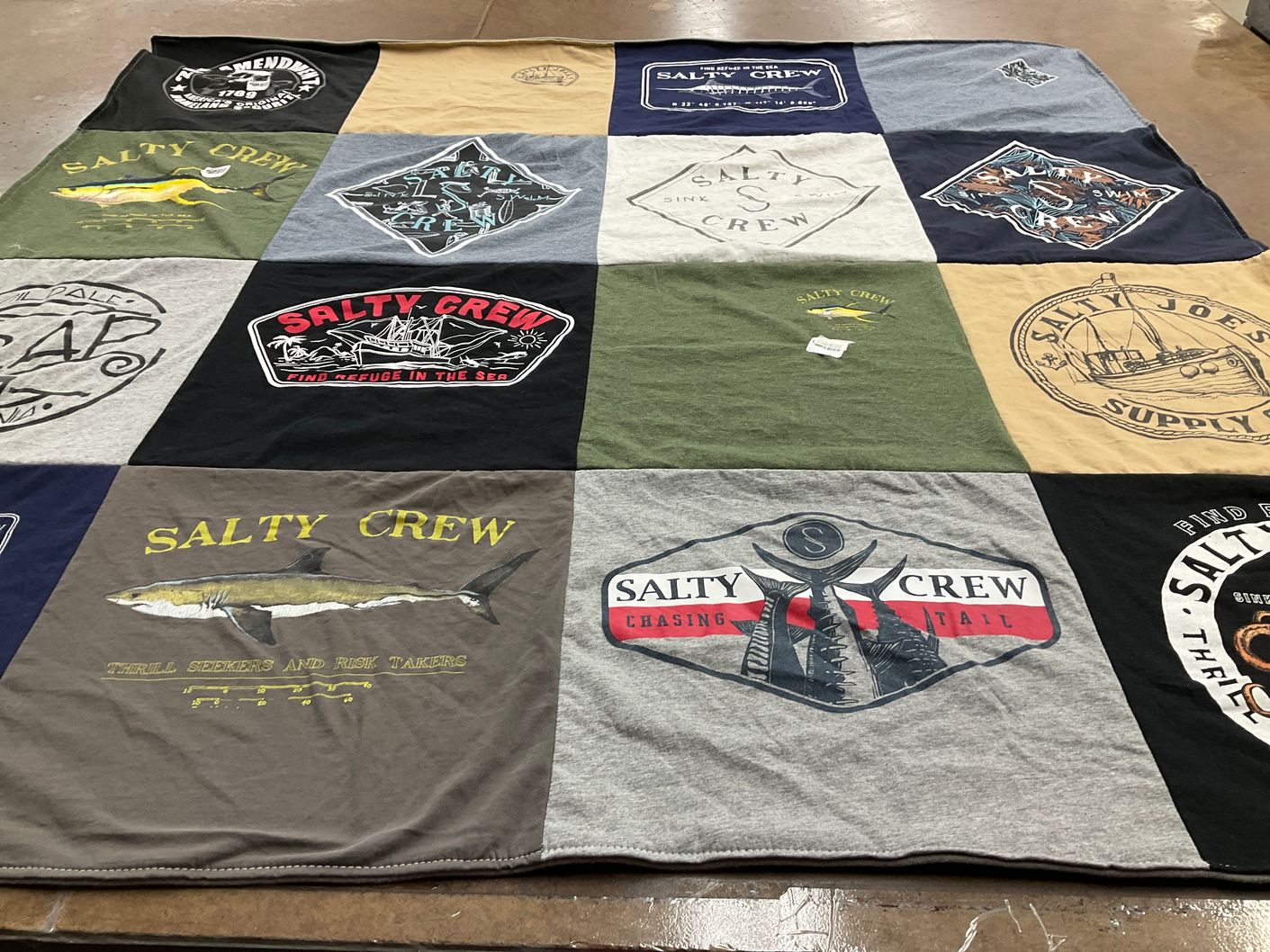 T-shirt quilt with fishing, marine life themes by Connie from CA