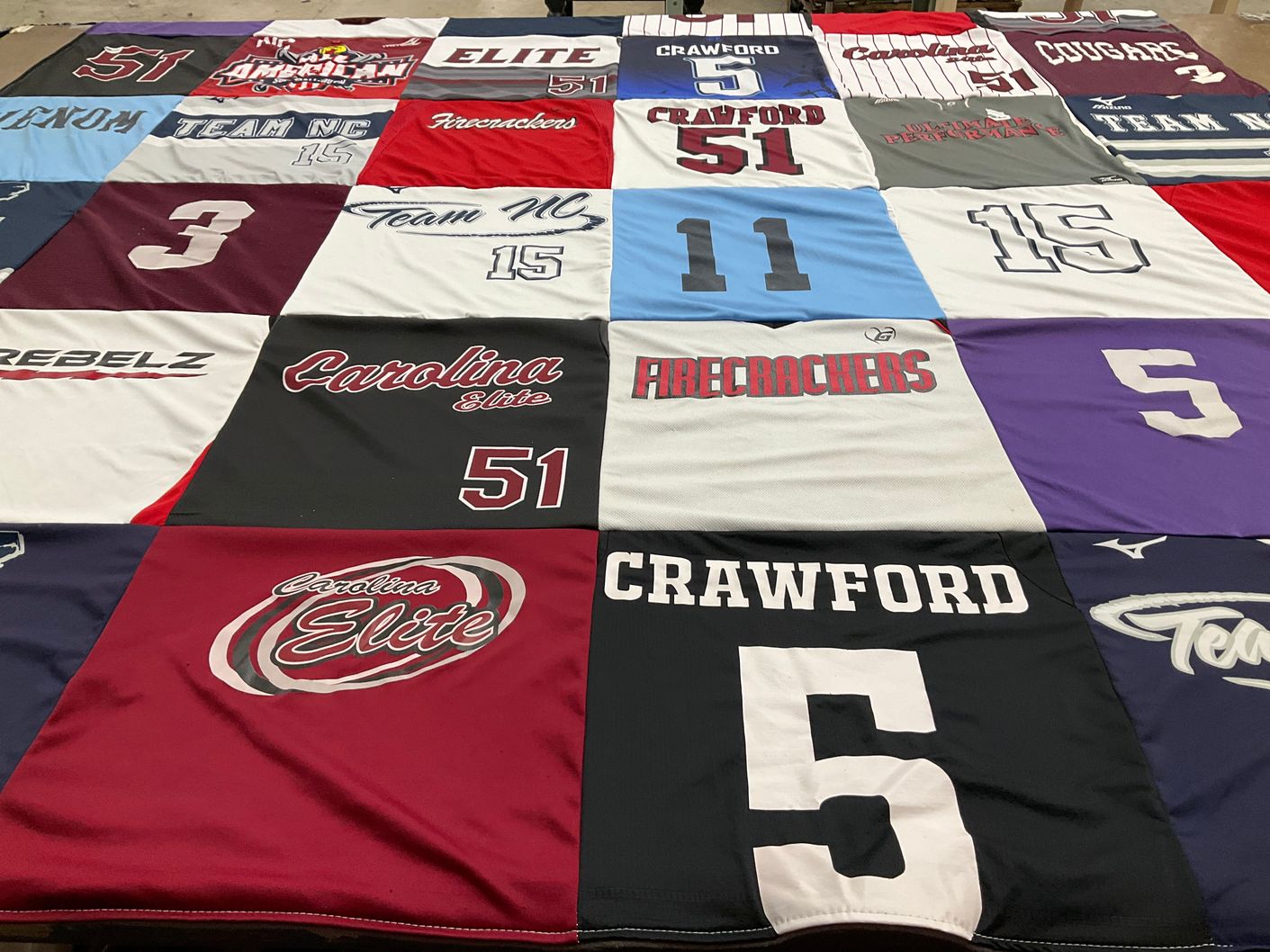 T-shirt quilt featuring carolina elite, firecrackers by Kristeen from NC