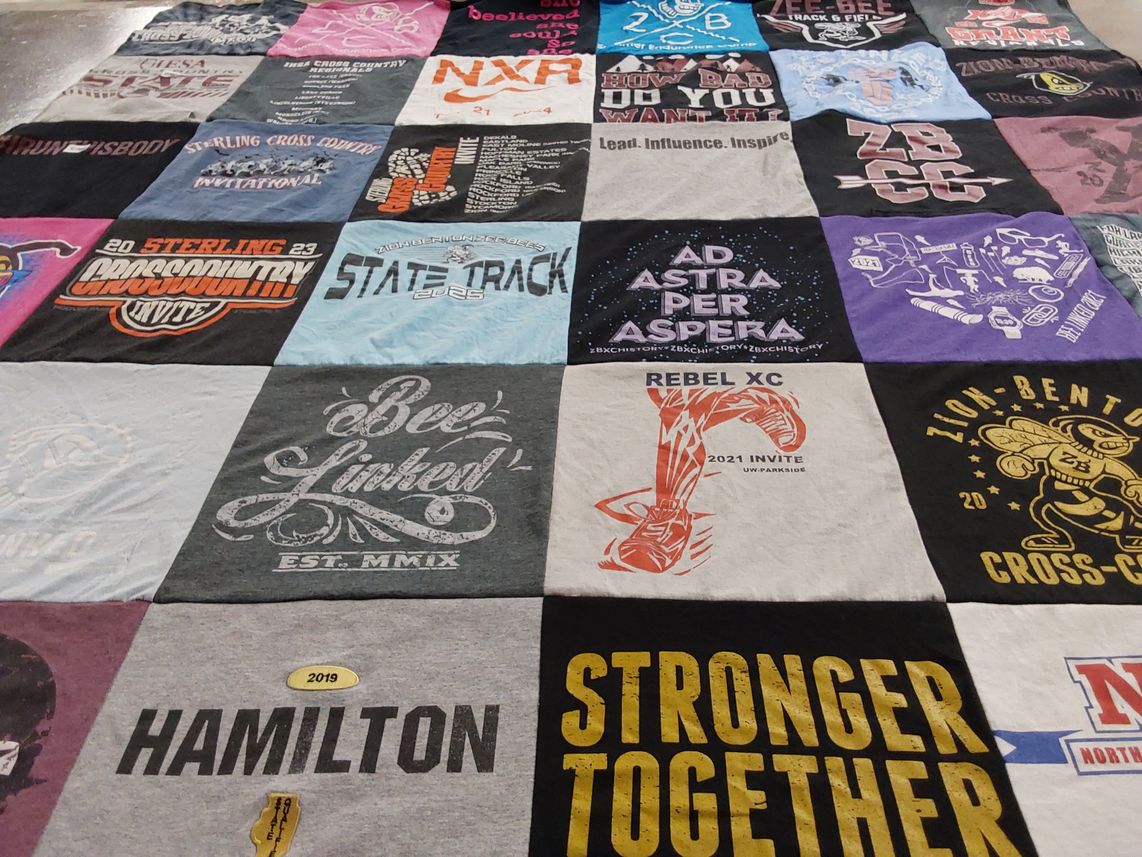 T-shirt quilt featuring zion benton high school cross country team, sterling high school cross country team by Jeanne from IL