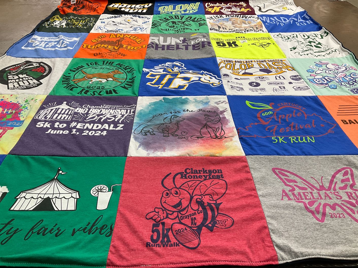 T-shirt quilt with running, community events themes by Martha from KY