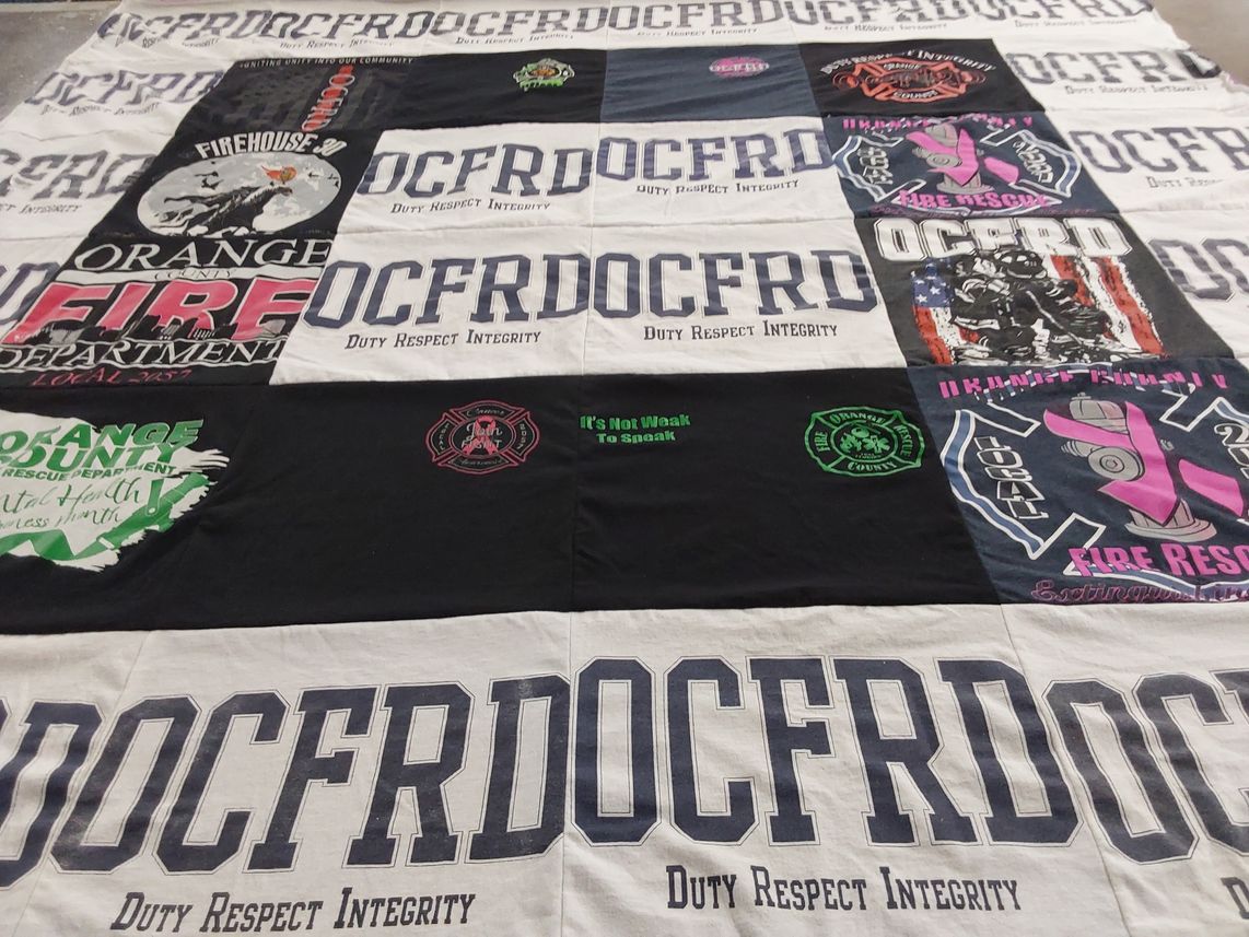 T-shirt quilt with firefighting, community service themes by Elizabeth from FL