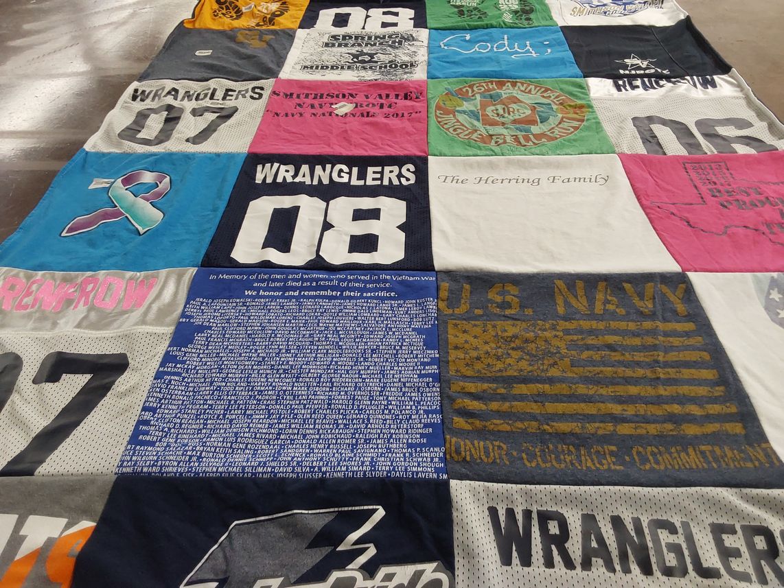 T-shirt quilt with military, sports themes by Kathy from TX